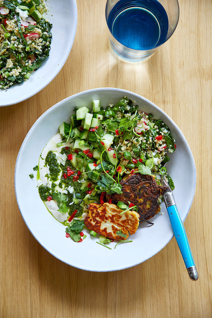 Courgette fritters with tahini sauce, halloumi and kale salad