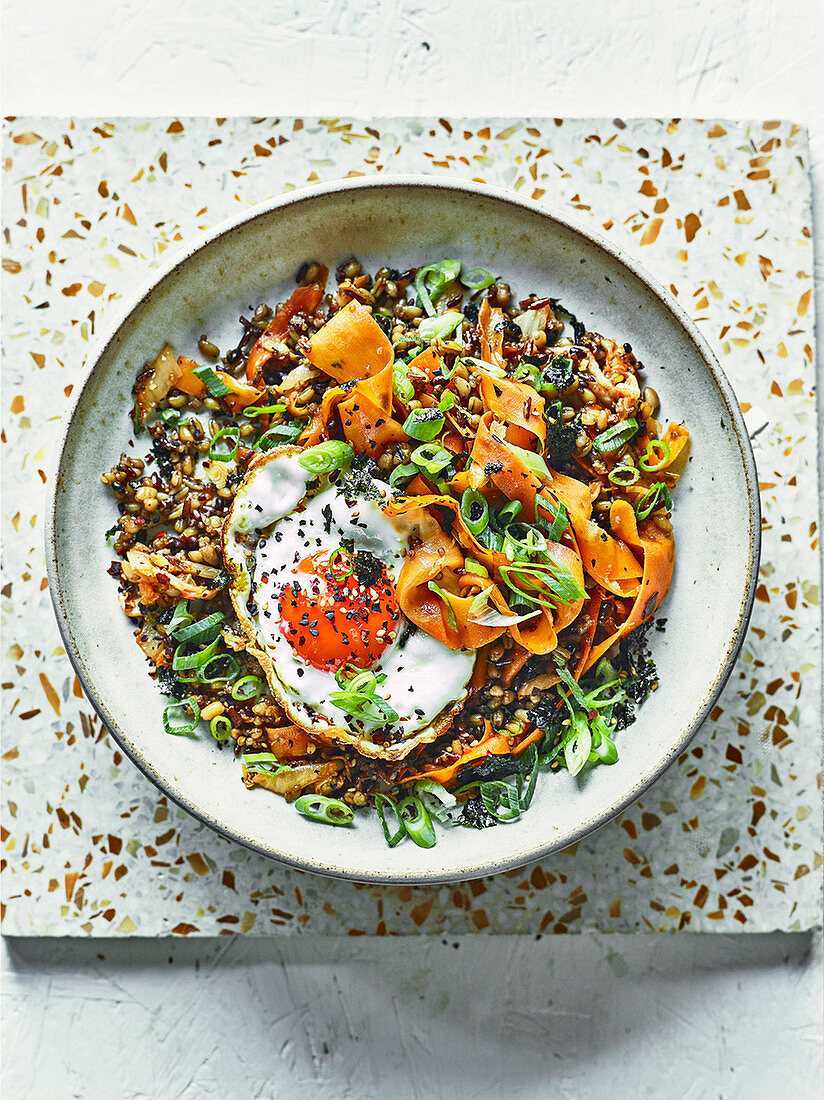 Kimchi-fried grains with crispy fried egg and nori