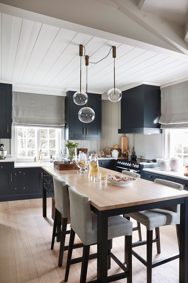 Dining table and upholstered chairs in kitchen