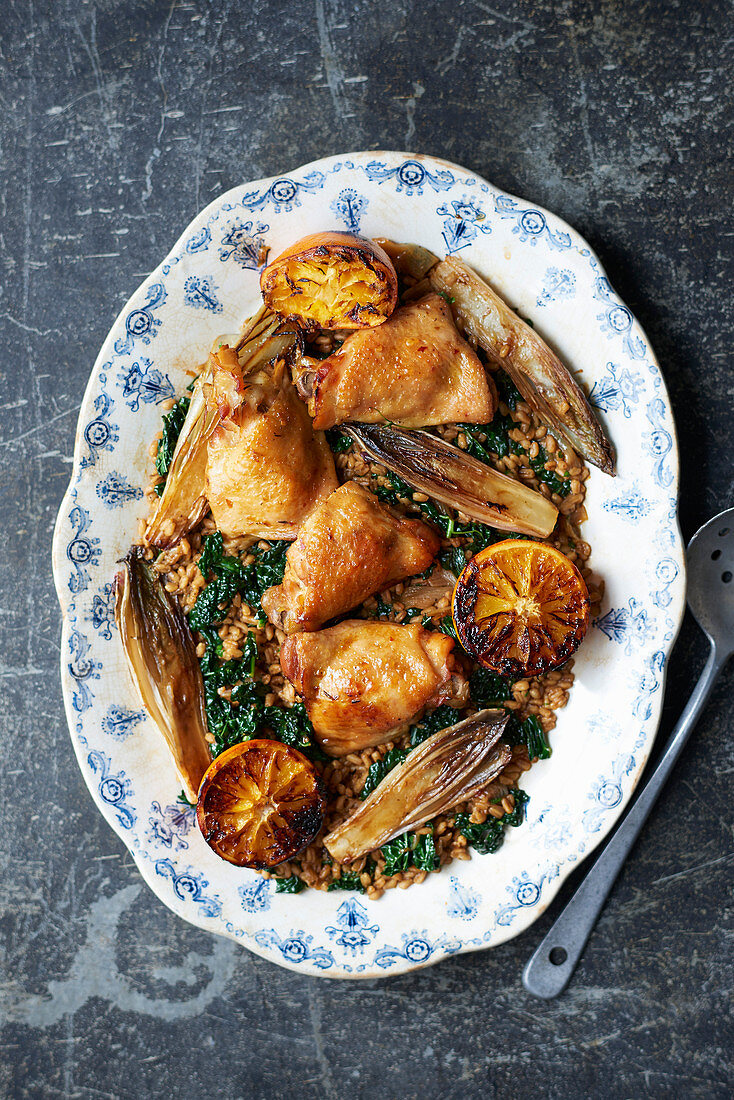 Roast chicken with oranges, chicory and spelt