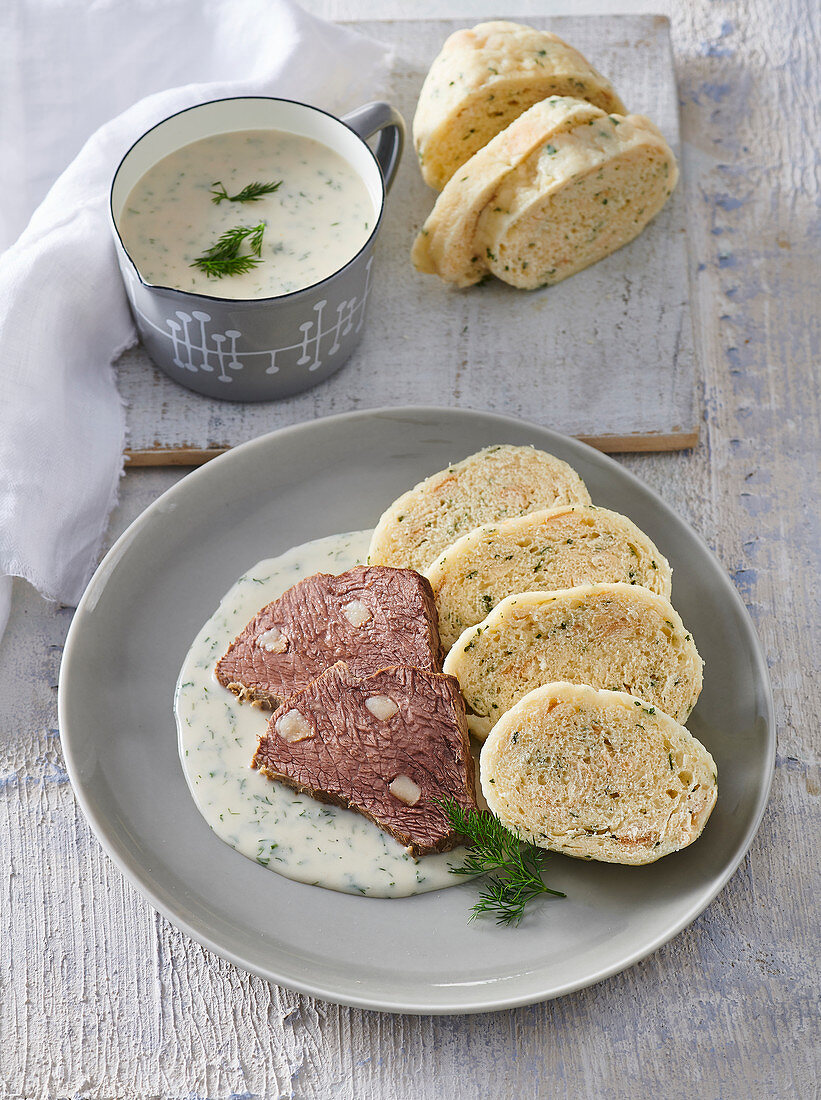 Larded beef with dill sauce and napkin dumplings