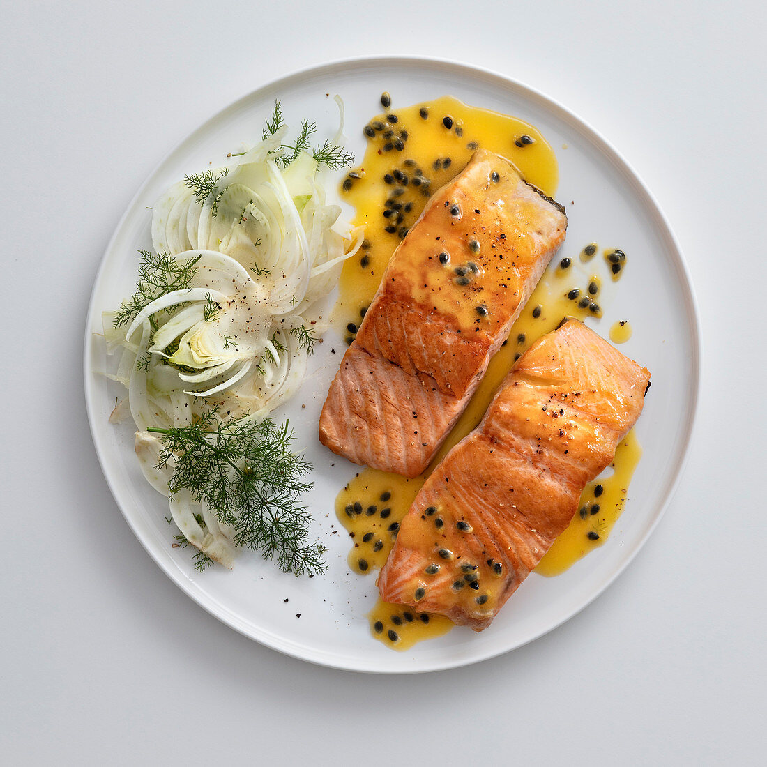 Salmon with fennel salad and a passion fruit and honey sauce