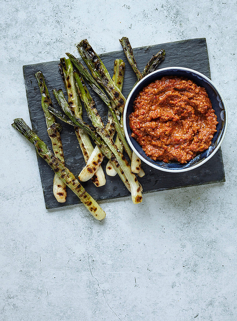 Charred spring onions and romesco