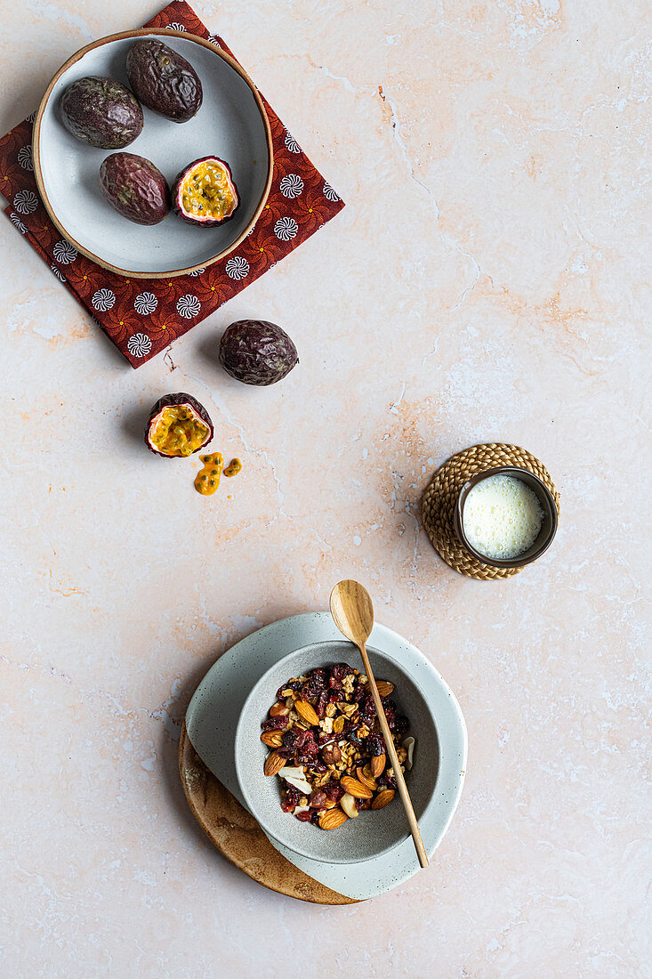 Muesli with nuts and fresh granadilla (passion fruit)