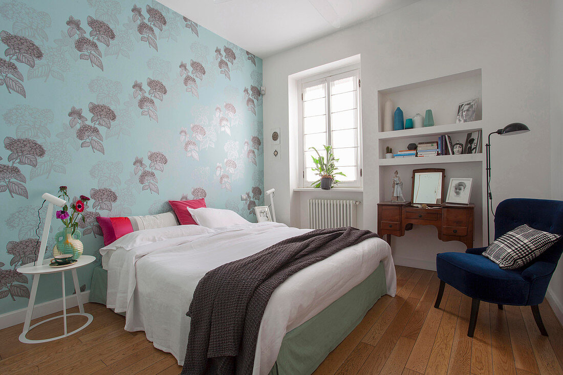 Pale blue floral wallpaper in classic bedroom