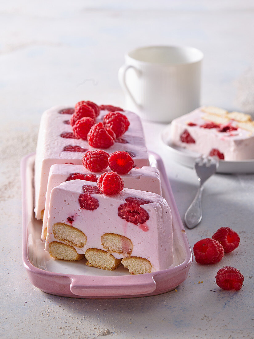 Unbaked cheese dessert with raspberries