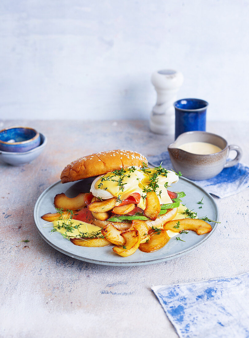 A burger with graved lax, avocado, poached egg and apple