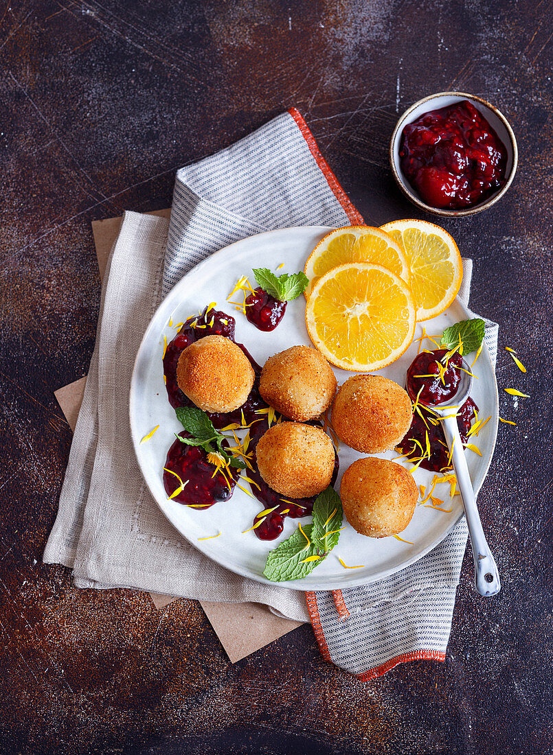 Rice balls with red berry compote