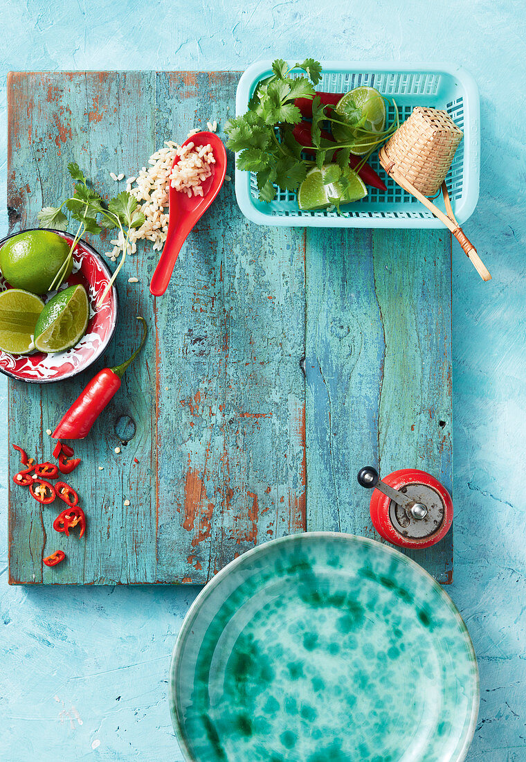 Oriental ingredients (chilli peppers, limes, rice and coriander)