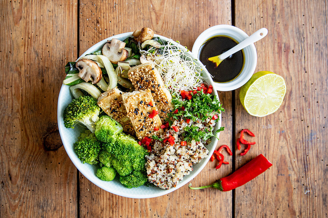 Quinoa bowl with tofu, broccoli and chard
