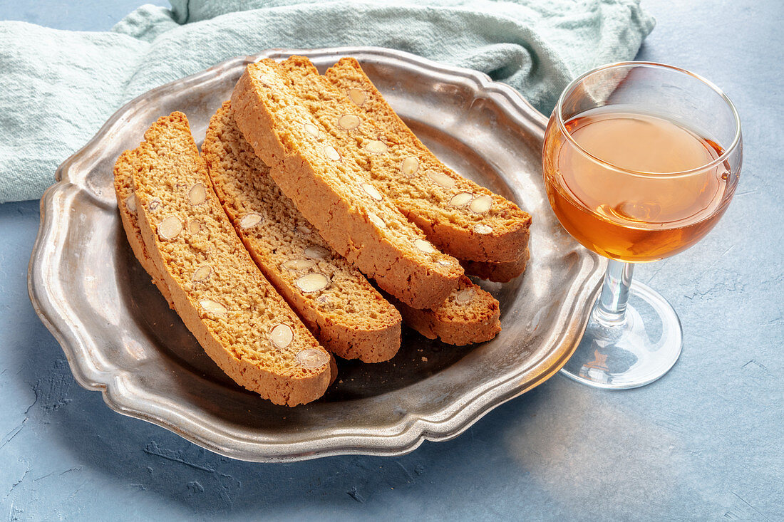 Biscotti, traditional Italian almond biscuits, with a glass of santo sweet wine