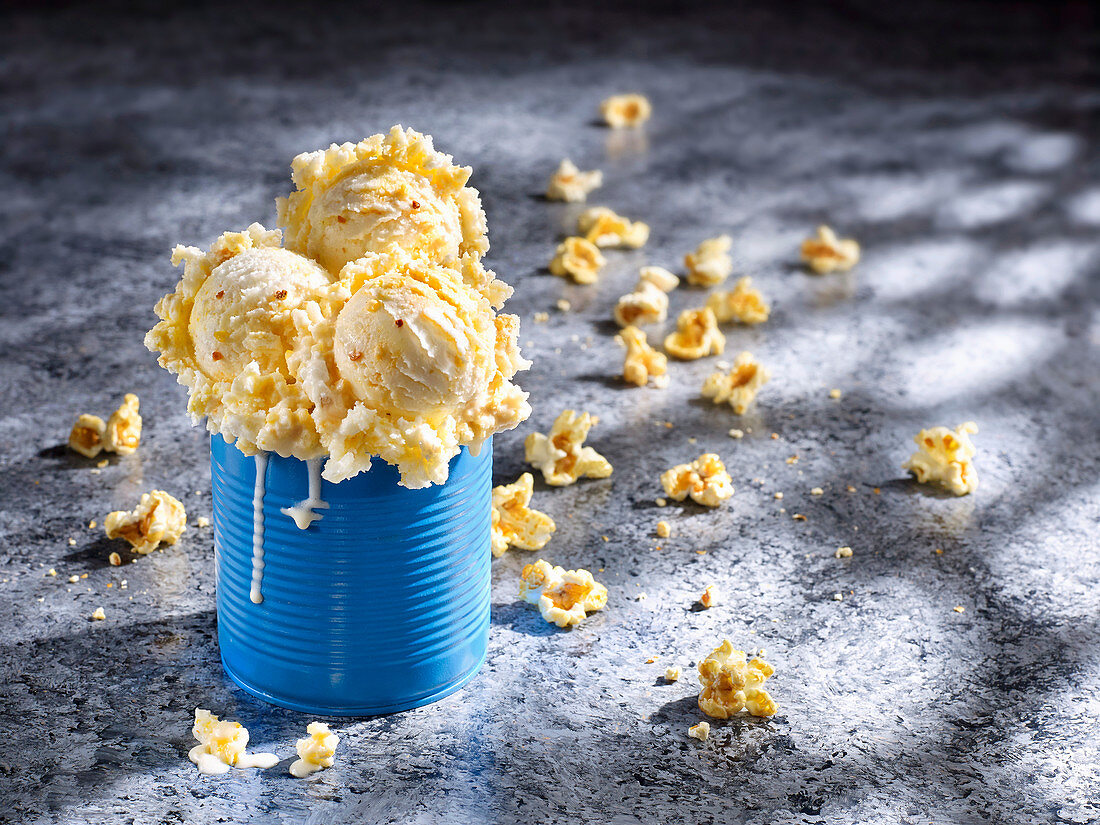 Popcorn ice cream served in a blue tin can