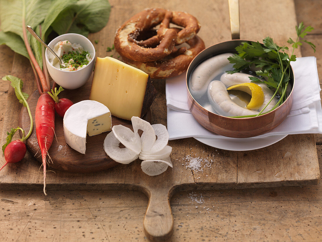 Ingredients for Bavarian snacks (white sausage, pretzel, cheese)
