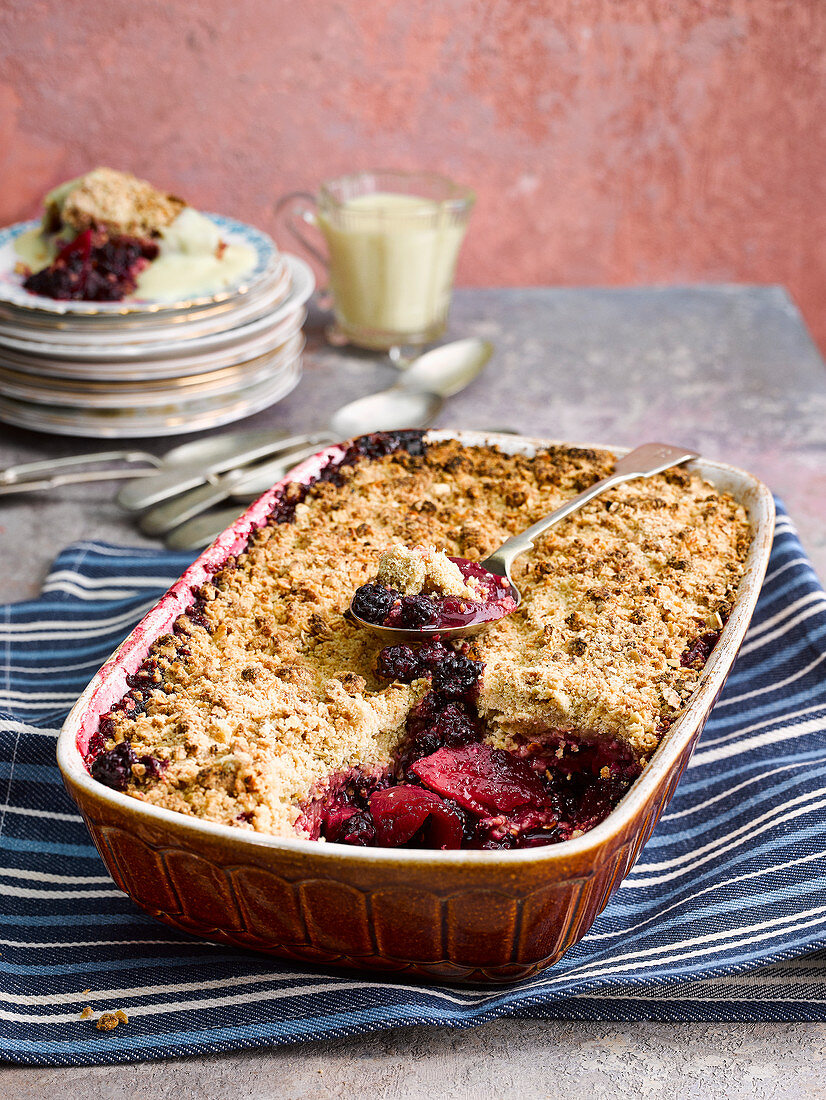Blackberry and apple crumble with custard