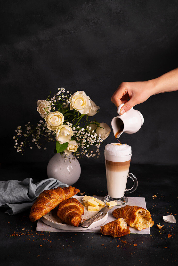 Breakfast - French croissants with butter and latte