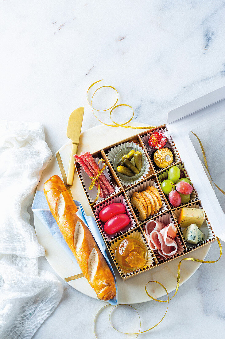 Spicy and sweet snacks for Christmas, decoratively arranged in a box