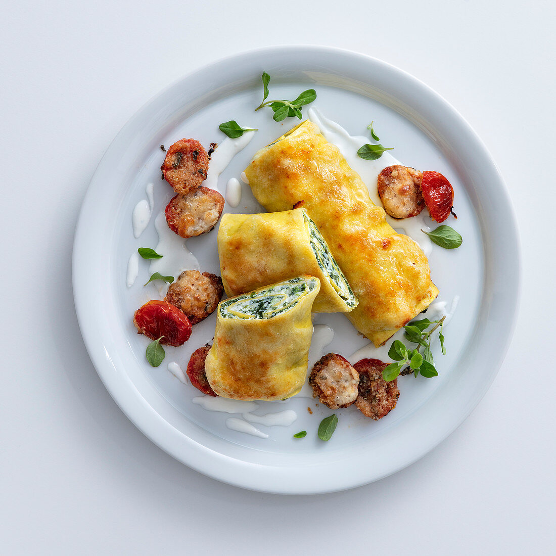 Cannelloni with a ricotta and herb filling and gratinated date tomatoes