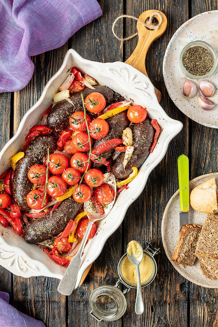 Black pudding baked with pepper and tomatoes