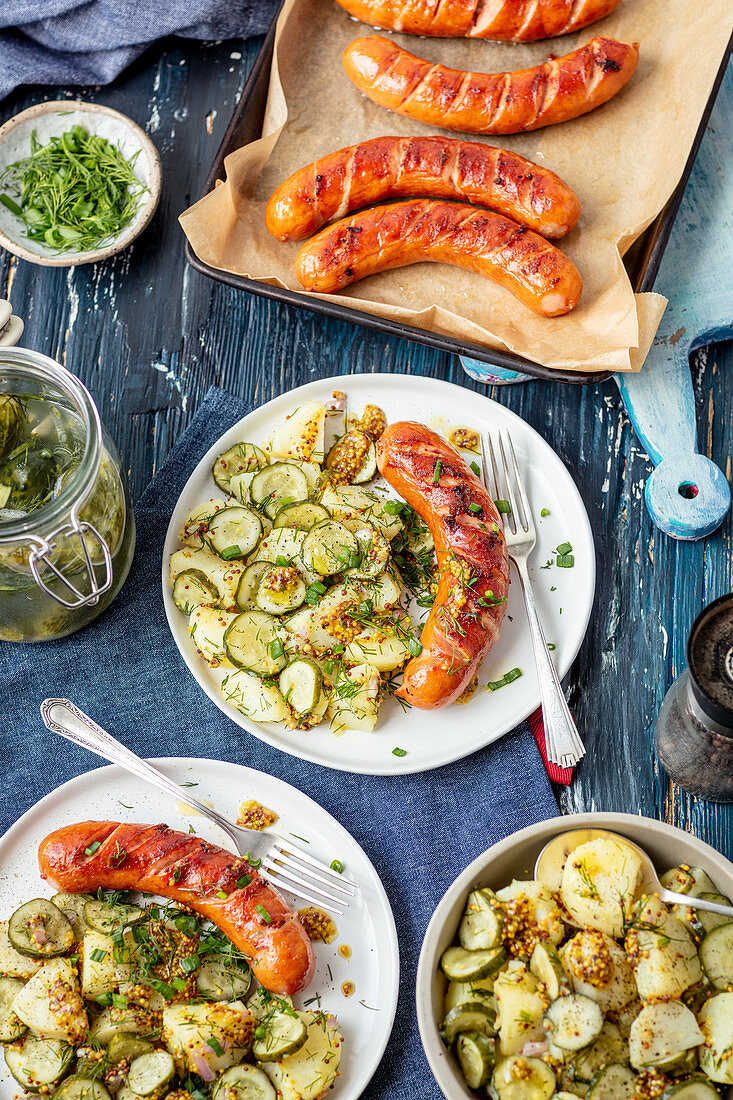 Baked sausage with potatao and sour cucumber salad