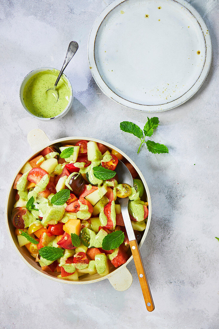Salad of melon and tomatoes with mint and elderflower dressing