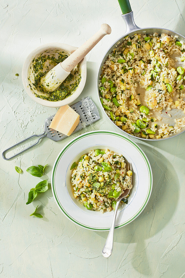 Courgette and broad bean risotto with basil pesto
