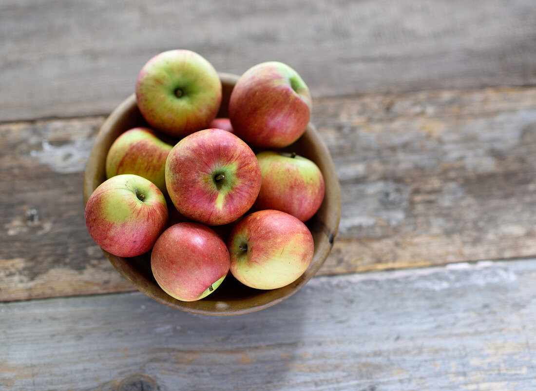 Garden apples in an olive wood bowl