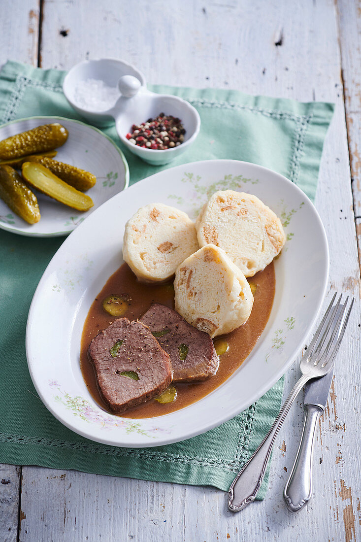 Boiled beef filet with pickled cucumber sauce and bun dumpligs