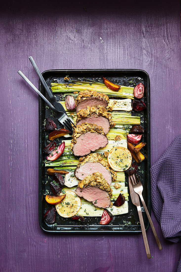 Beef fillet with a mustard crust, leek and beets in an orange vinaigrette