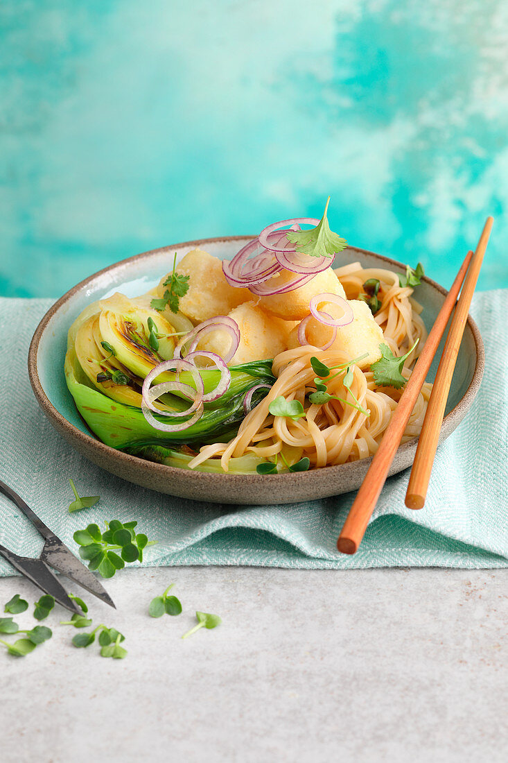 Oriental noodles with crispy fish and bok choy