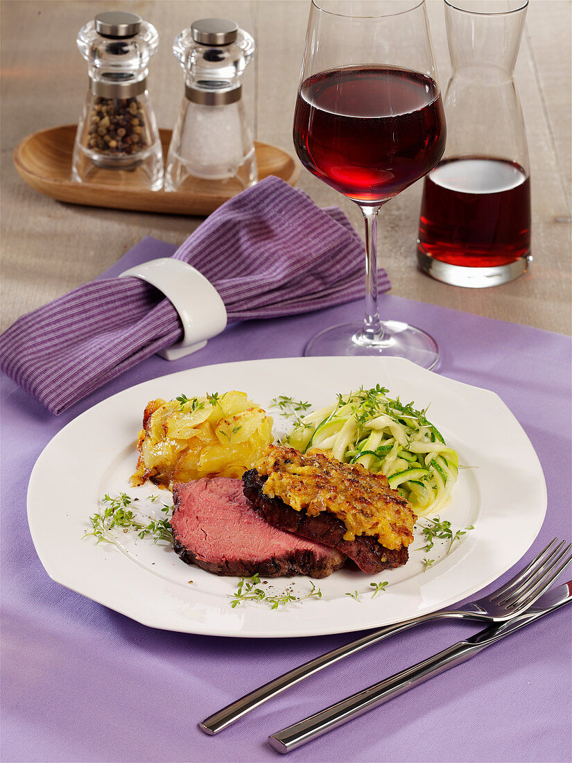 Fillet steak with shallot crust, zoodles and potato gratin