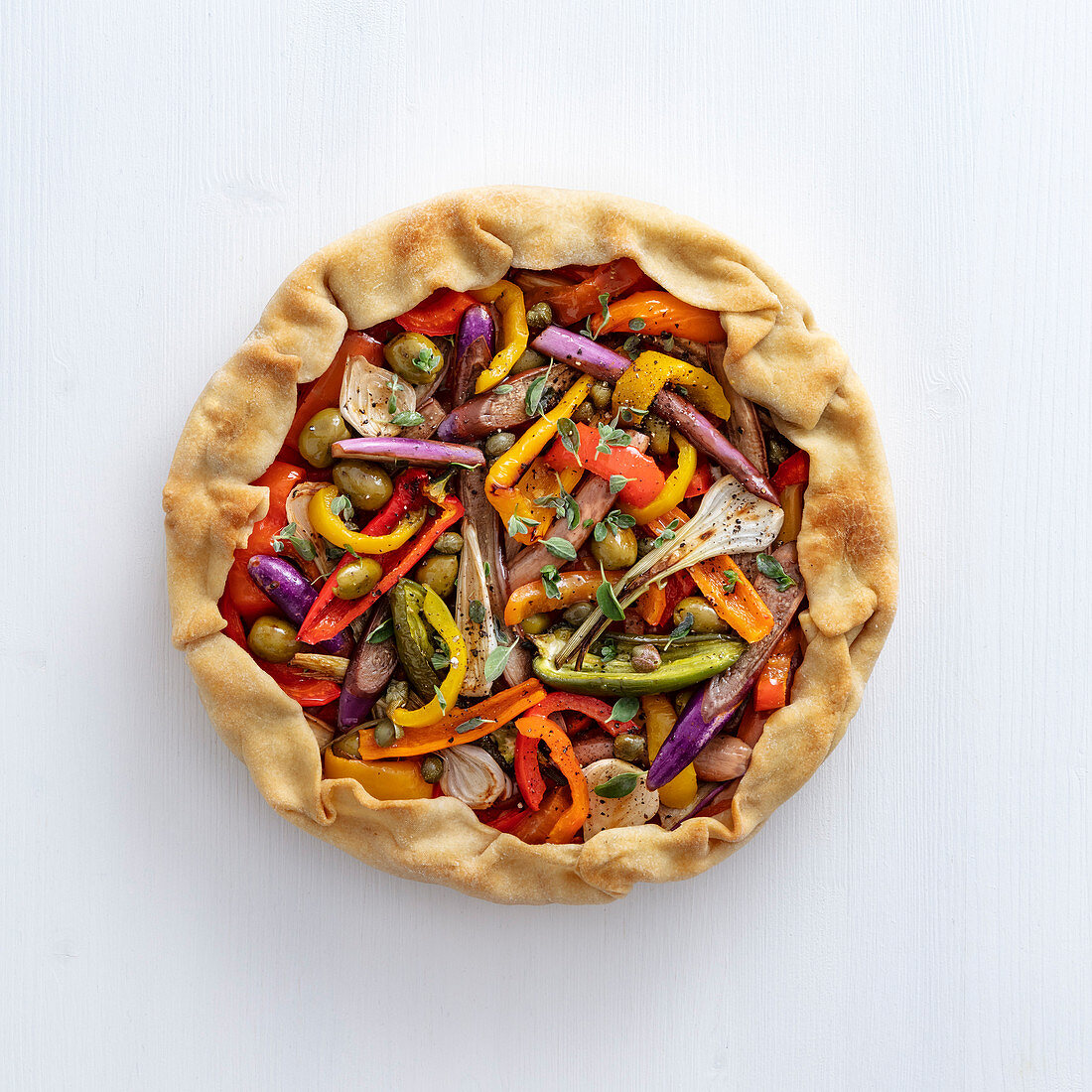 Vegetable tart with olives and capers