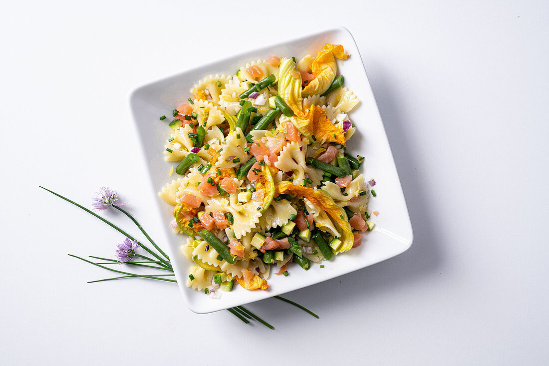 Farfalle with salmon and courgette flowers