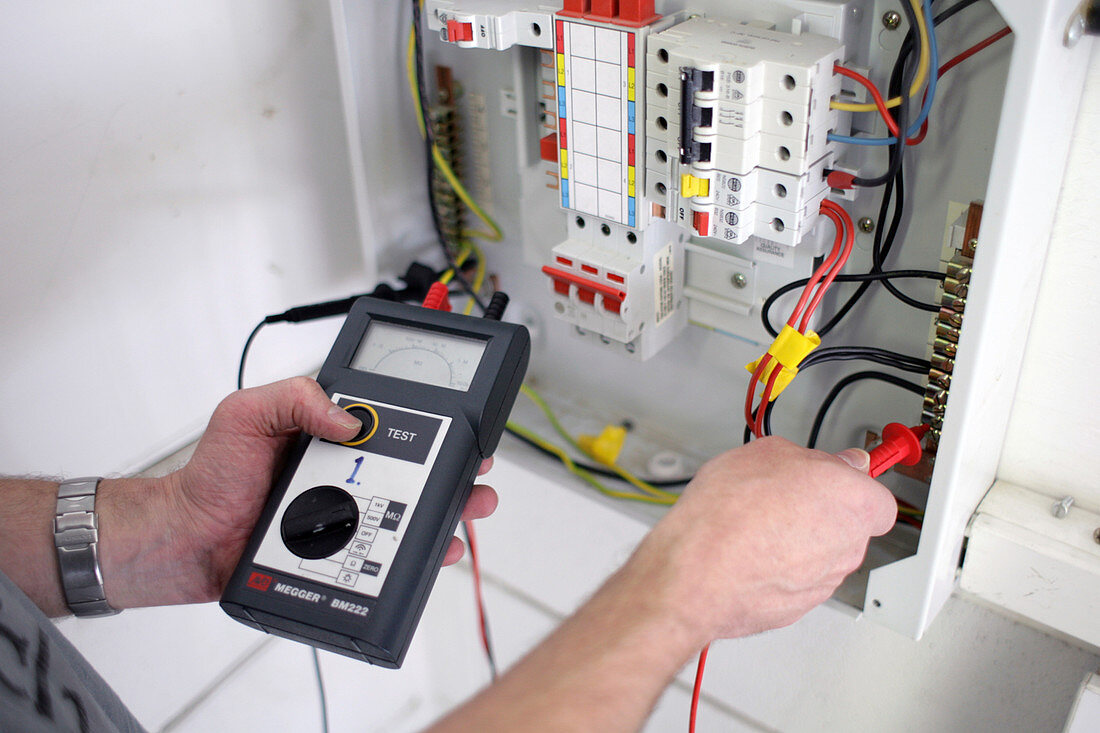 Electrician testing domestic consumer unit