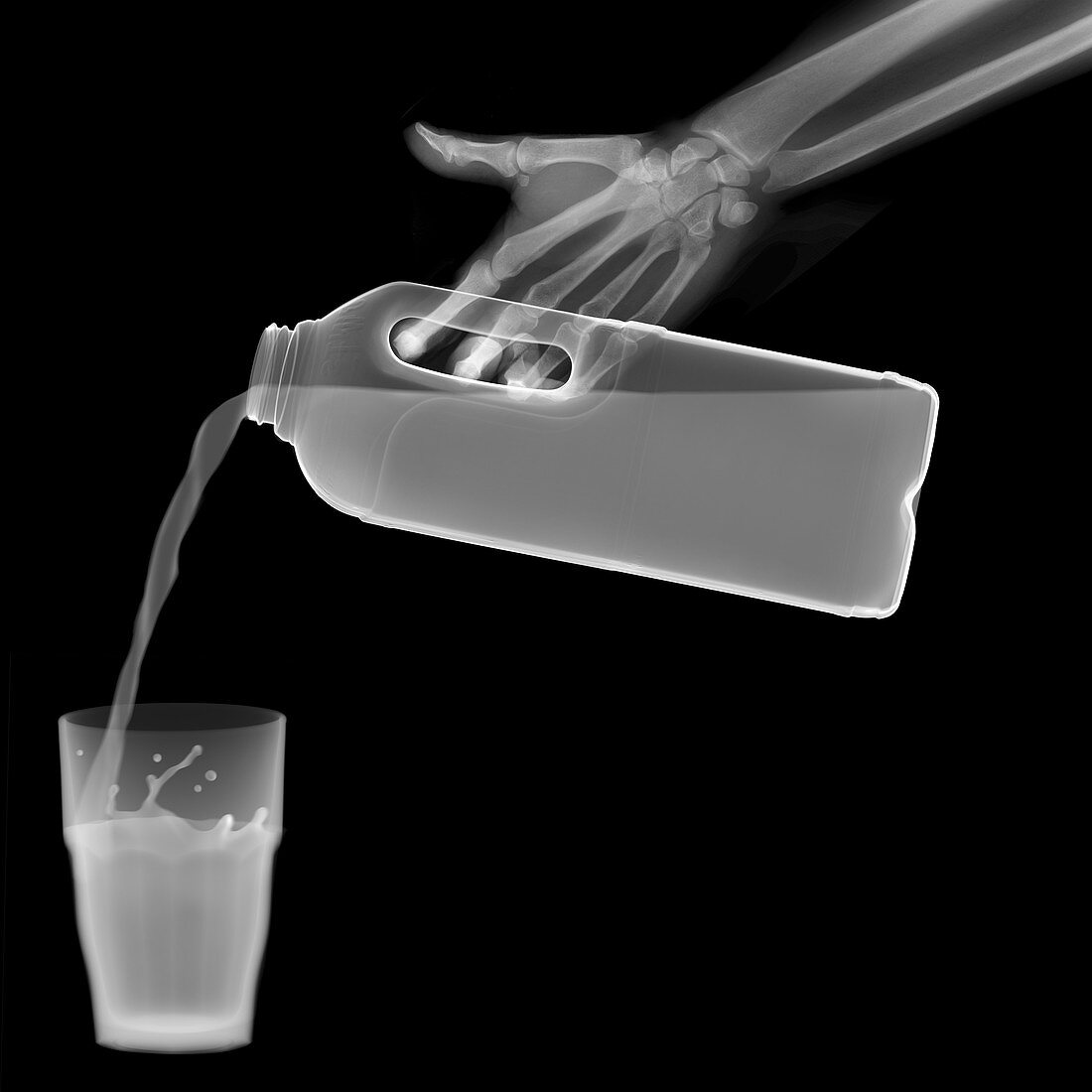Milk pouring into a tumbler, X-ray