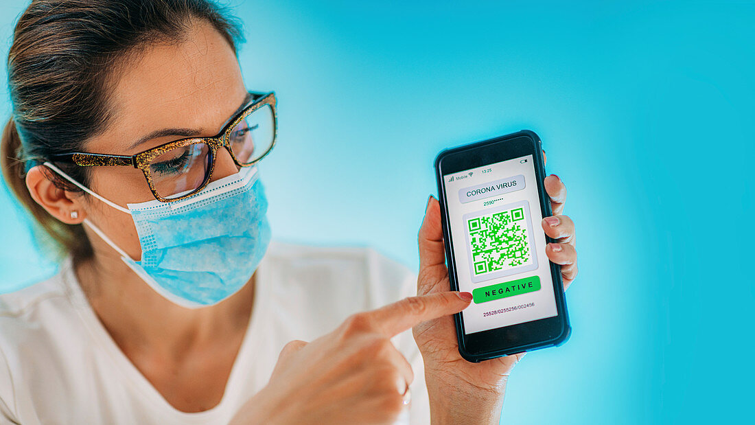 Woman showing smartphone with coronavirus app
