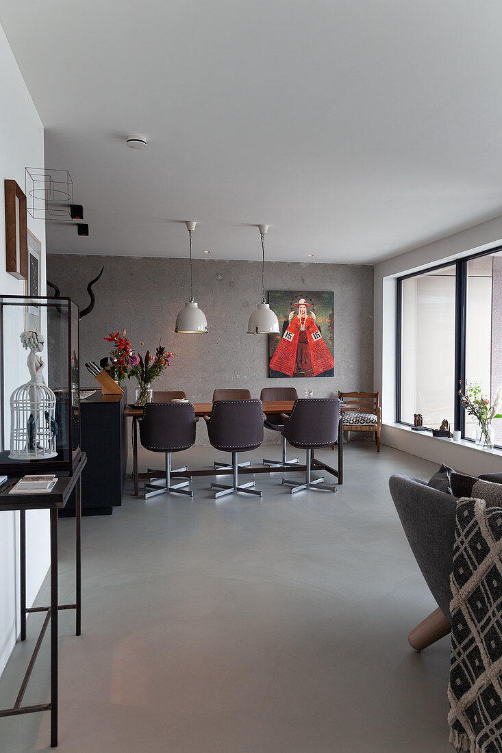 Open-plan interior with dining table in background