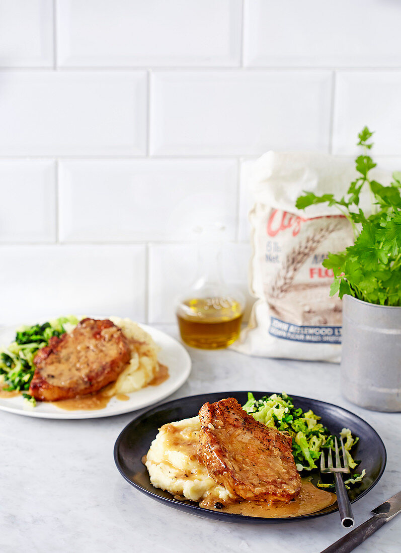 Pork chops in cider and juniper with creamy mash