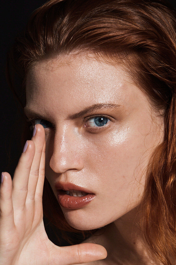 A red-haired woman wearing make up – portrait shot