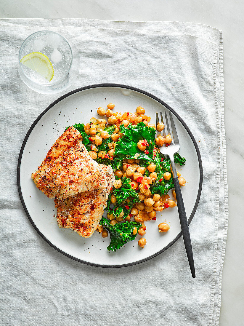 Healthy, grilled hake with smoky chickpeas, preserved lemon and kale