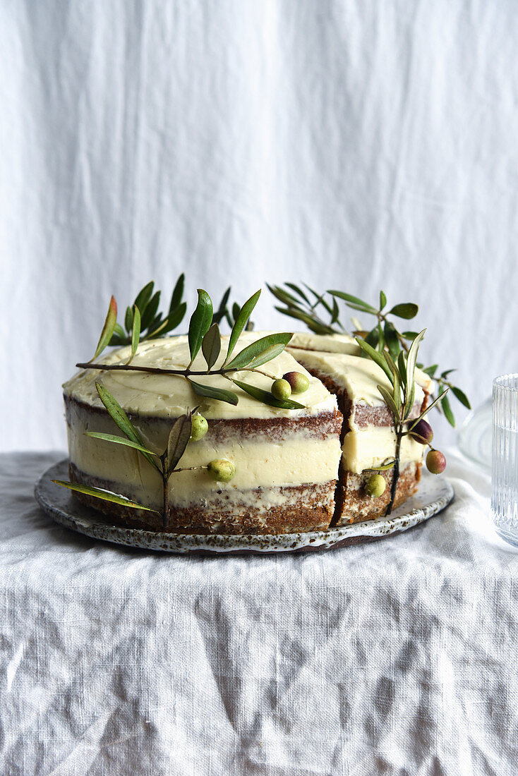 Carrot cake decorated with olive branches, glutenfree