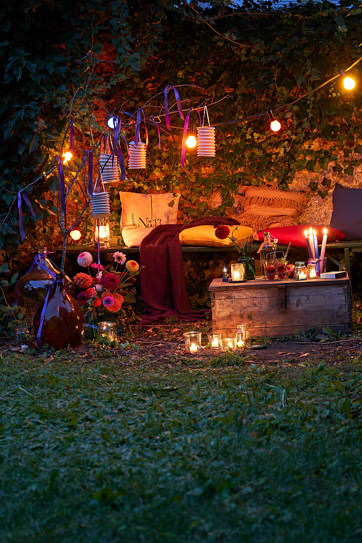 Fairy lights in romantic ivy-covered arbour at twilight