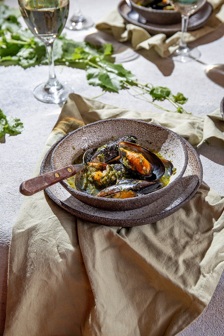 Mediterranean style dinner with Mussels in green sauce and white wine