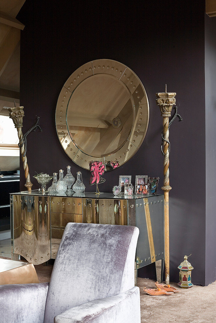 Ornaments on mirrored sideboard