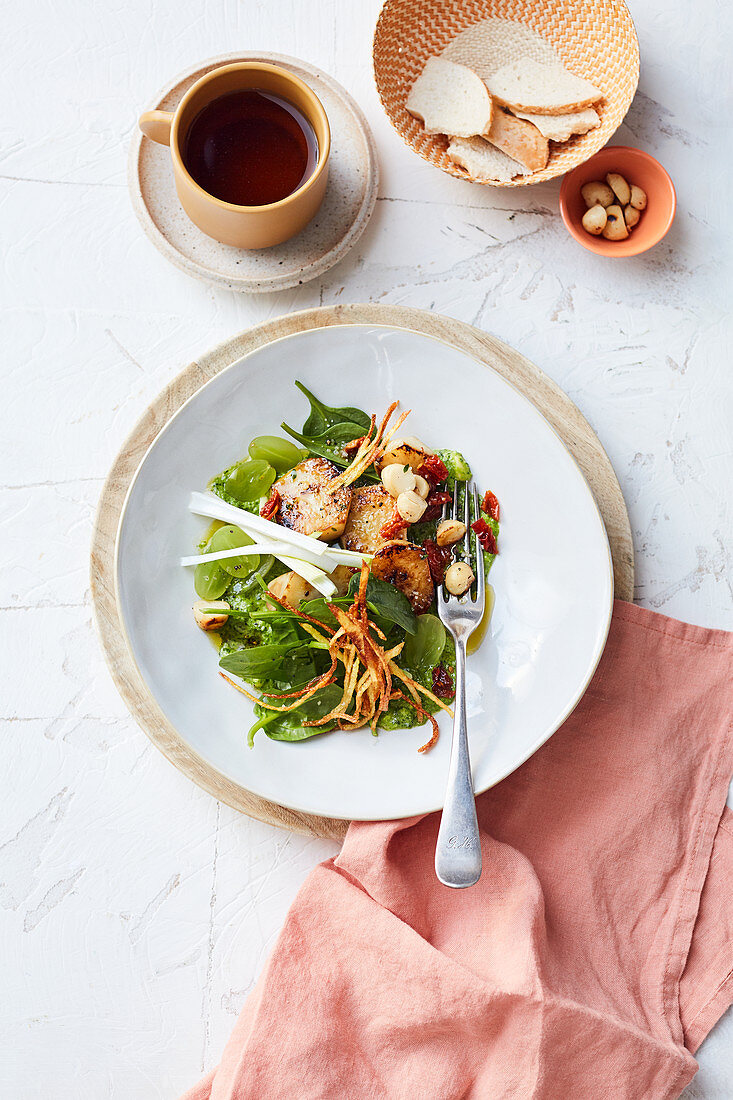 Baby spinach with roasted Jerusalem artichokes and parsley pesto