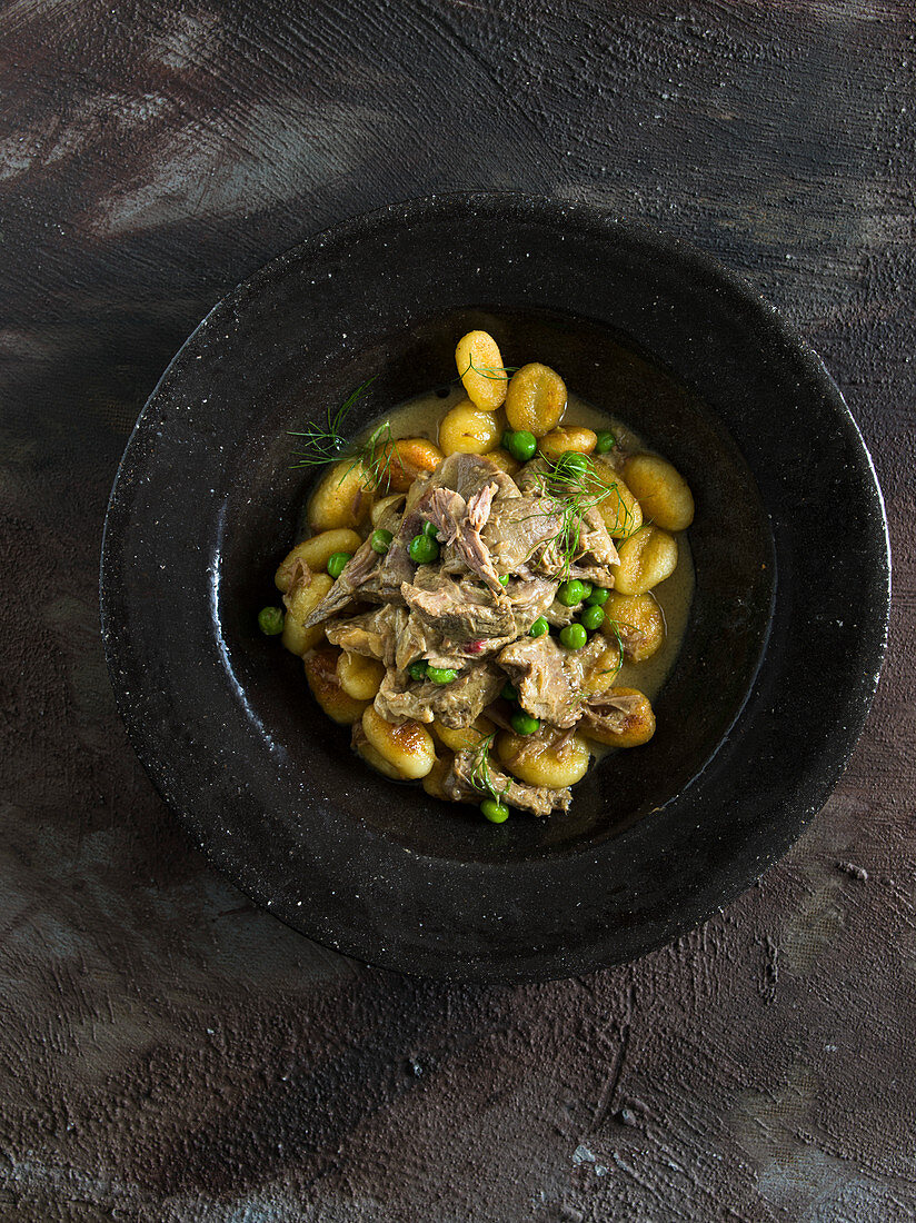 Braised Mutton shank with peas on gnocchi