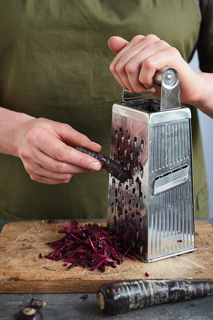 Root vegetables being grated