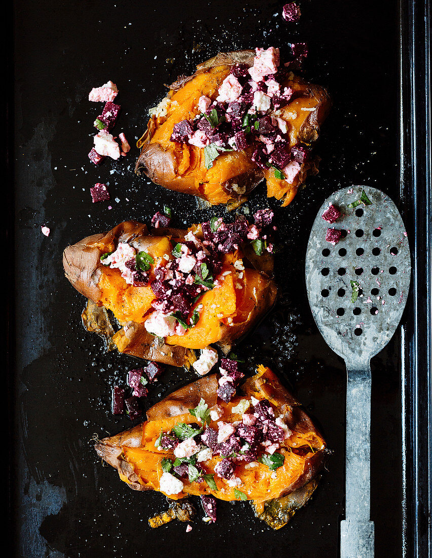 Smashed sweet potatoes with a beetroot and feta cheese salad