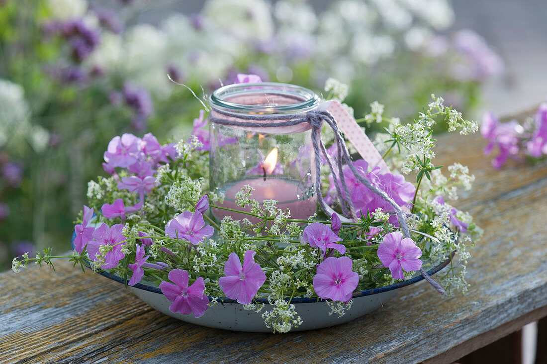 Lantern in a wreath of white bedstraw and Phlox flowers
