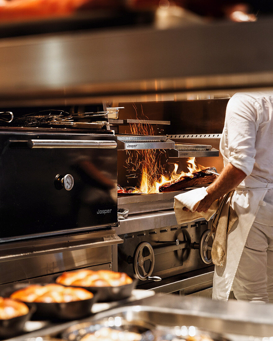 A chef working in a restaurant kitchen