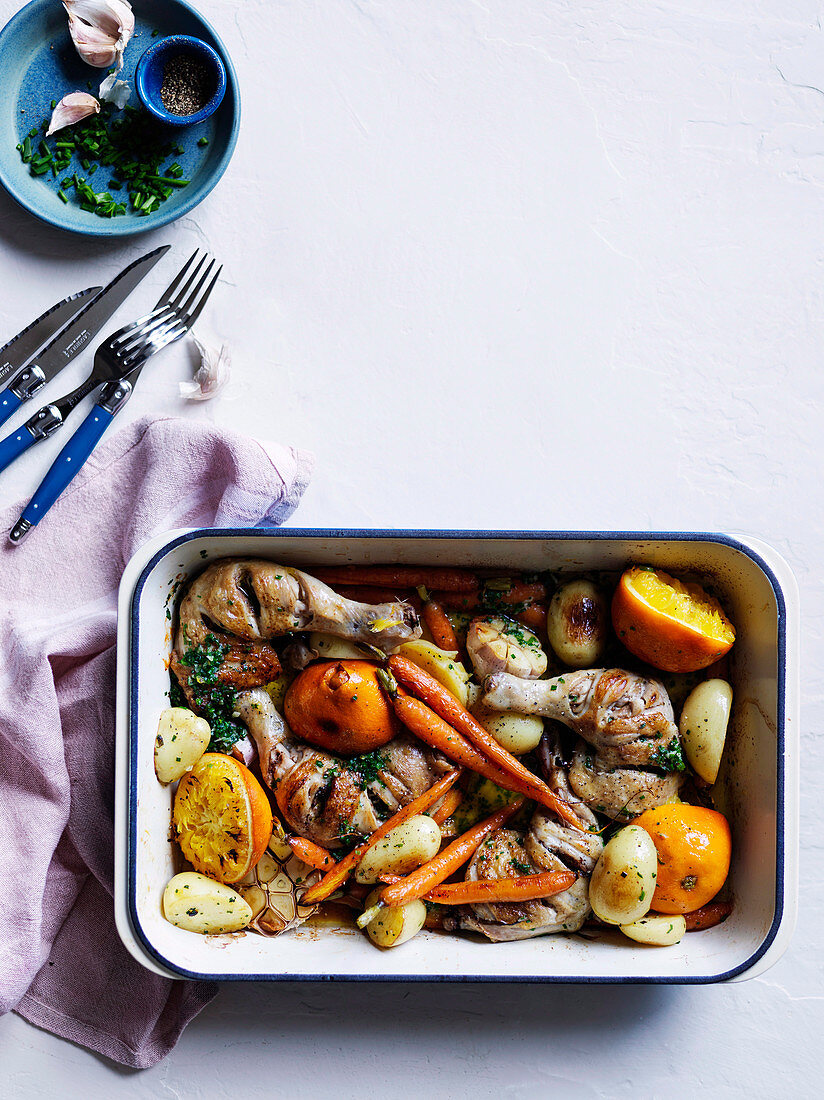 Chicken, carrot and orange tray bake with chive butter